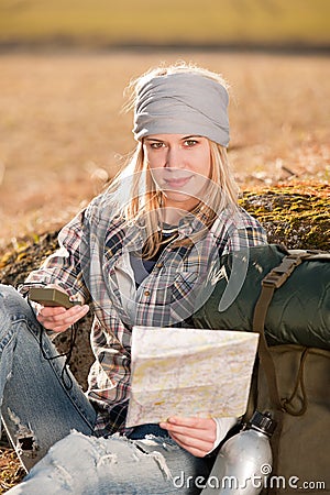 Camping young woman search navigation compass map Stock Photo