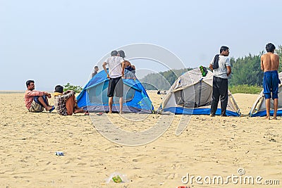 Campsite on beach. Tents on sea beach with sky and green background. Tent on the beach, Bay area day trip activities. Editorial Stock Photo