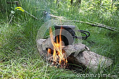 Campsite cooking on fire Stock Photo