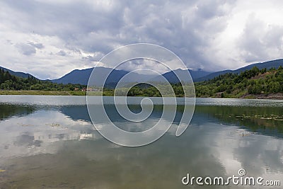 Mountain landscape reflectin in Campul lui Neag lake Stock Photo