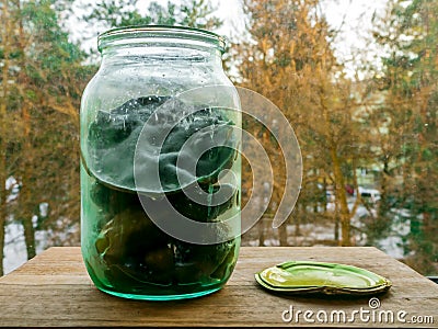 Can of pickled cucumbers with mold Stock Photo