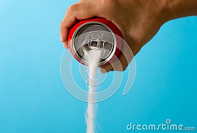 Can pouring sugar stream in calories content of soda energetic and refreshing drinks Stock Photo