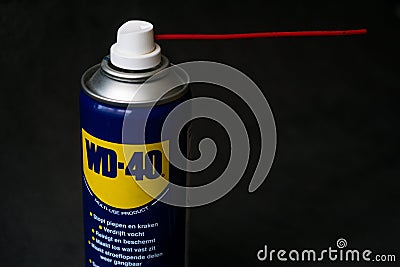 Can of WD-40 aerosolum on black background, illustrative editorial image Editorial Stock Photo