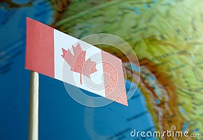 Canada flag with a globe map as a background Stock Photo