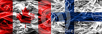 Canada vs Finland smoke flags placed side by side. Canadian and Stock Photo