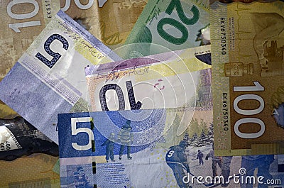 Canadian currency dollars of denomination 5, 10, 20 and 100 Stock Photo