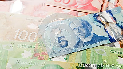 Canadian currency. Dollars. Overhead view of bills of different Editorial Stock Photo