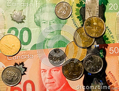 Canadian Dollars and Coins Editorial Stock Photo