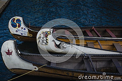 Canadian first nation canoes on water Stock Photo