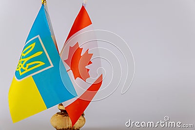 Canadian flag and Ukrainian national flags. Symbol of Canadian Ukrainian friendship Stock Photo