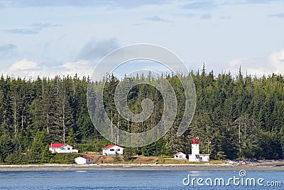 Canadian lighthouse and buildings on Inside Passage cruise. Editorial Stock Photo