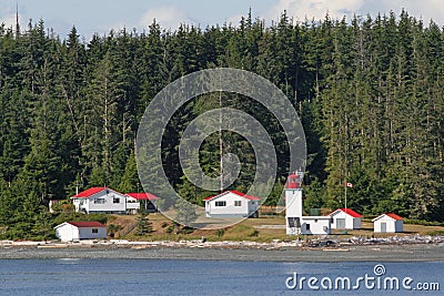 Canadian lighthouse and buildings on Inside Passage cruise. Editorial Stock Photo