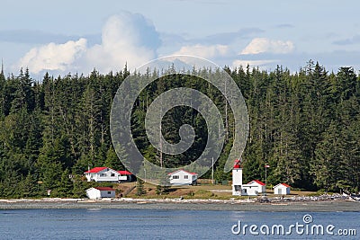 Canadian lighthouse and buildings on Inside Passage cruise. Editorial Stock Photo