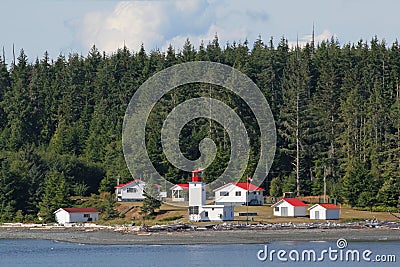 Canadian lighthouse and buildings on Inside Passage cruise. Editorial Stock Photo