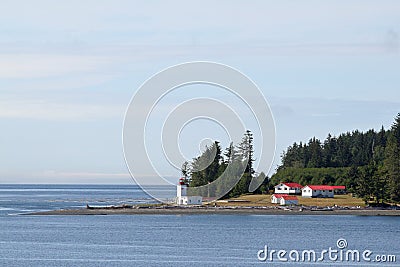 Canadian lighthouse and buildings on Inside Passage cruise. Editorial Stock Photo