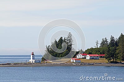 Canadian lighthouse and buildings on Inside Passage cruise. Editorial Stock Photo
