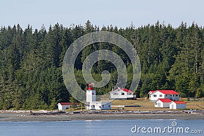 Canadian lighthouse and buildings on Inside Passage cruise. Editorial Stock Photo