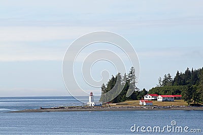 Canadian lighthouse and buildings on Inside Passage cruise. Editorial Stock Photo