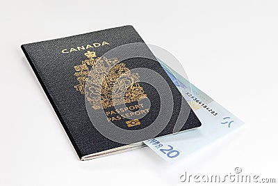 Canadian passport with 20 Euros banknote Editorial Stock Photo