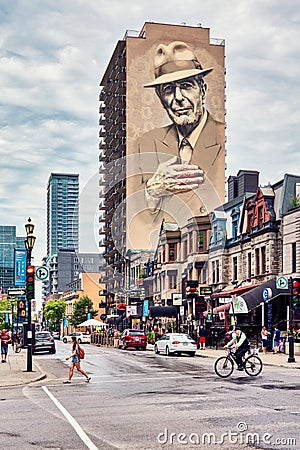 Canadian singer Leonard Cohen mural or monument painted on a building on Crescent street in Montreal, Quebec, Canada Editorial Stock Photo