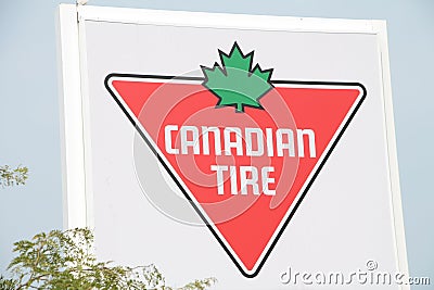 tor, canada - July 26, 2023: canadian tire logo store sign by road save up to 75 percent on select items. P Editorial Stock Photo