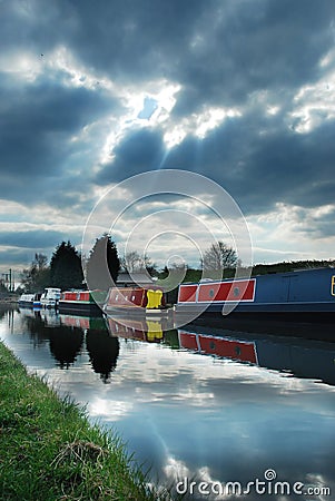 Canal boats under moody sky Stock Photo