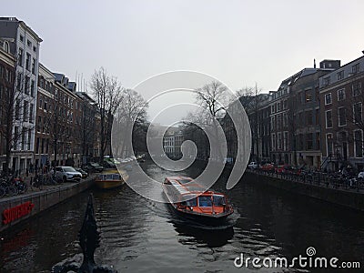Canal Ferry Cruising Through Amsterdam Canal Editorial Stock Photo