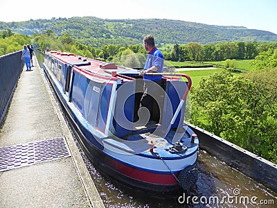 Canal narrowboat cruising over aqueduct Editorial Stock Photo