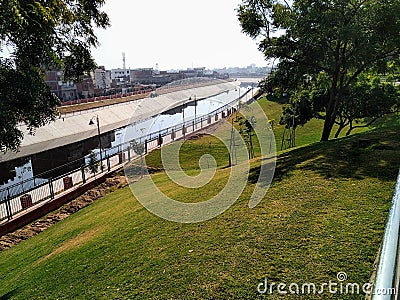 Canal passing through city in india stock image Editorial Stock Photo