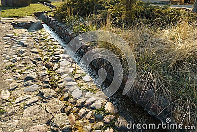 Canal with spring water in city Sabile in Latvia Stock Photo