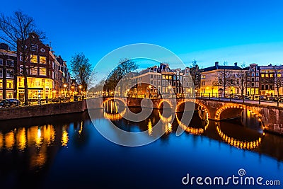 Canals of Amsterdam at night. Amsterdam is the capital and most populous city of the Netherlands Stock Photo