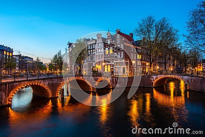 Canals of Amsterdam at night. Amsterdam is the capital and most populous city of the Netherlands Stock Photo