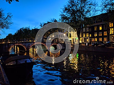 Canals in Amsterdam at night Stock Photo