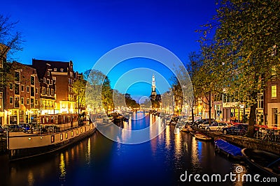 Canals of Amsterdam at night in Netherlands. Amsterdam is the capital and most populous city of the Netherlands Editorial Stock Photo