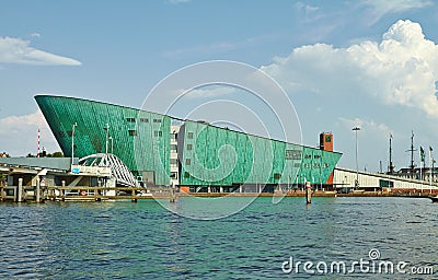 Canals and boats of Amsterdam. Nemo Children's Museum Editorial Stock Photo