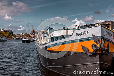 Canals and typical dutch ship docked in Amsterdam, the capital of the Netherlands Editorial Stock Photo