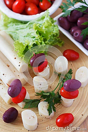 Canape of Heart of palm (palmito), cherry tomatos, olives Stock Photo