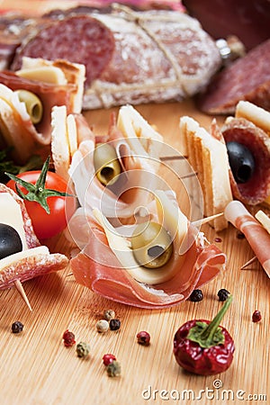 Canape with prosciutto and olives Stock Photo