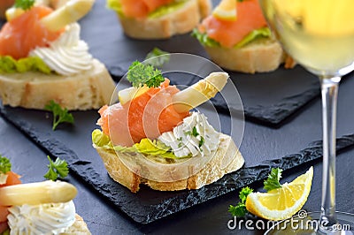 Canapes and white wine Stock Photo