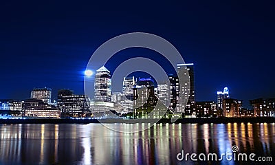 Canary wharf across the Thames at night Stock Photo