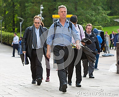 Canary Wharf business life. Group of business people going to work Editorial Stock Photo