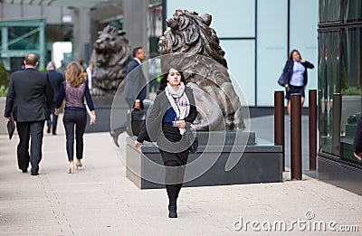 Canary Wharf business life. Group of business people going to work Editorial Stock Photo