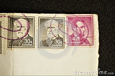 Cancelled Lee and Lincoln stamps on white envelope Editorial Stock Photo