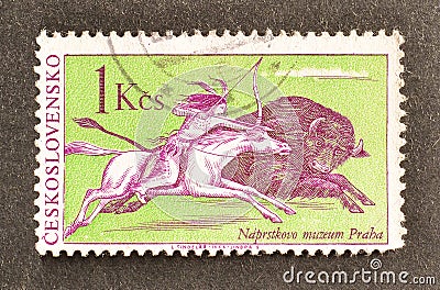 Cancelled postage stamp printed by Czechoslovakia, that shows Indian on horseback hunting buffalo Editorial Stock Photo