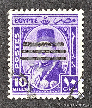 Cancelled postage stamp printed by Egypt, that shows king Farouk, overprinted Editorial Stock Photo