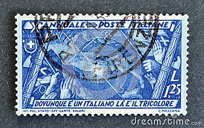 Cancelled postage stamp printed by Italy, that shows Italians Abroad Editorial Stock Photo