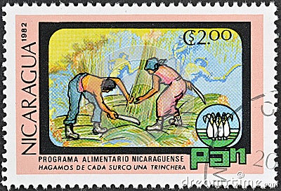 Cancelled postage stamp printed by Nicaragua, that shows Sugarcane harvest, World Food Day Editorial Stock Photo
