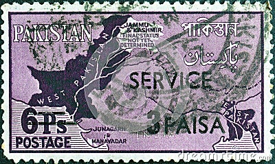 Cancelled postage stamp printed by Pakistan, that shows Map Showing Disputed Areas with New Currency Overprinted Editorial Stock Photo