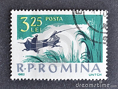 Cancelled postage stamp printed by Romania, that shows Fishing from the boat Editorial Stock Photo