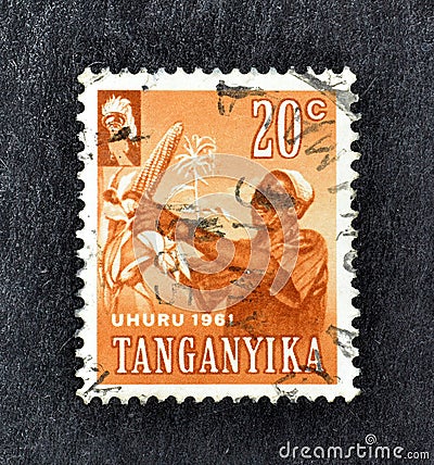 Cancelled postage stamp printed by Tanganyika, that shows Harvesting corn Editorial Stock Photo